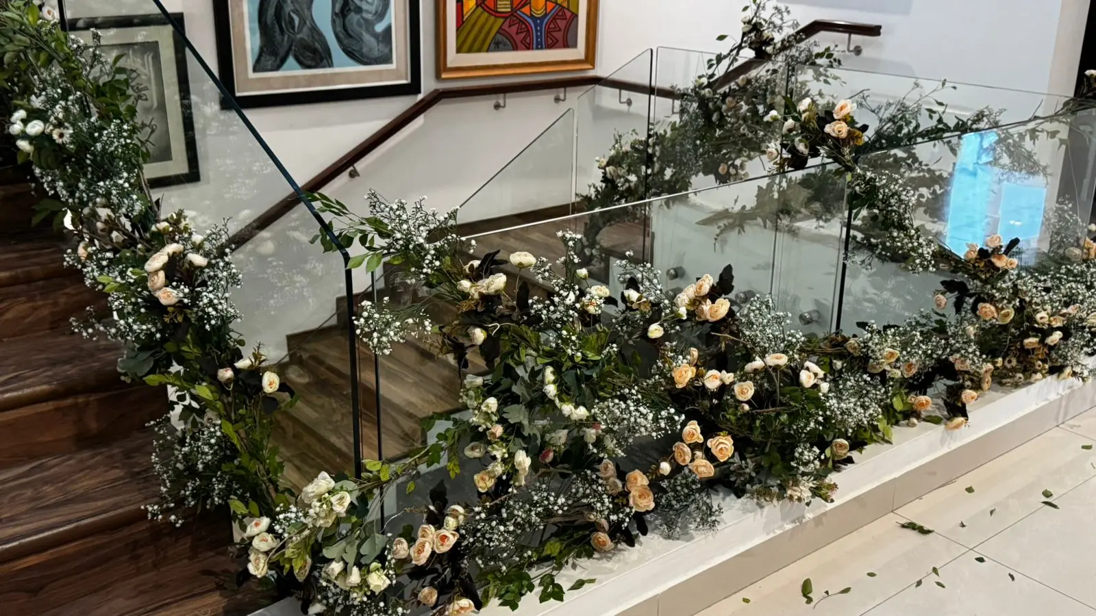 Florist installing floral wedding backdrop