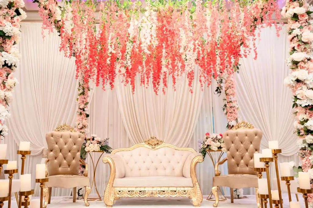 Indoor ballroom floral backdrop setup